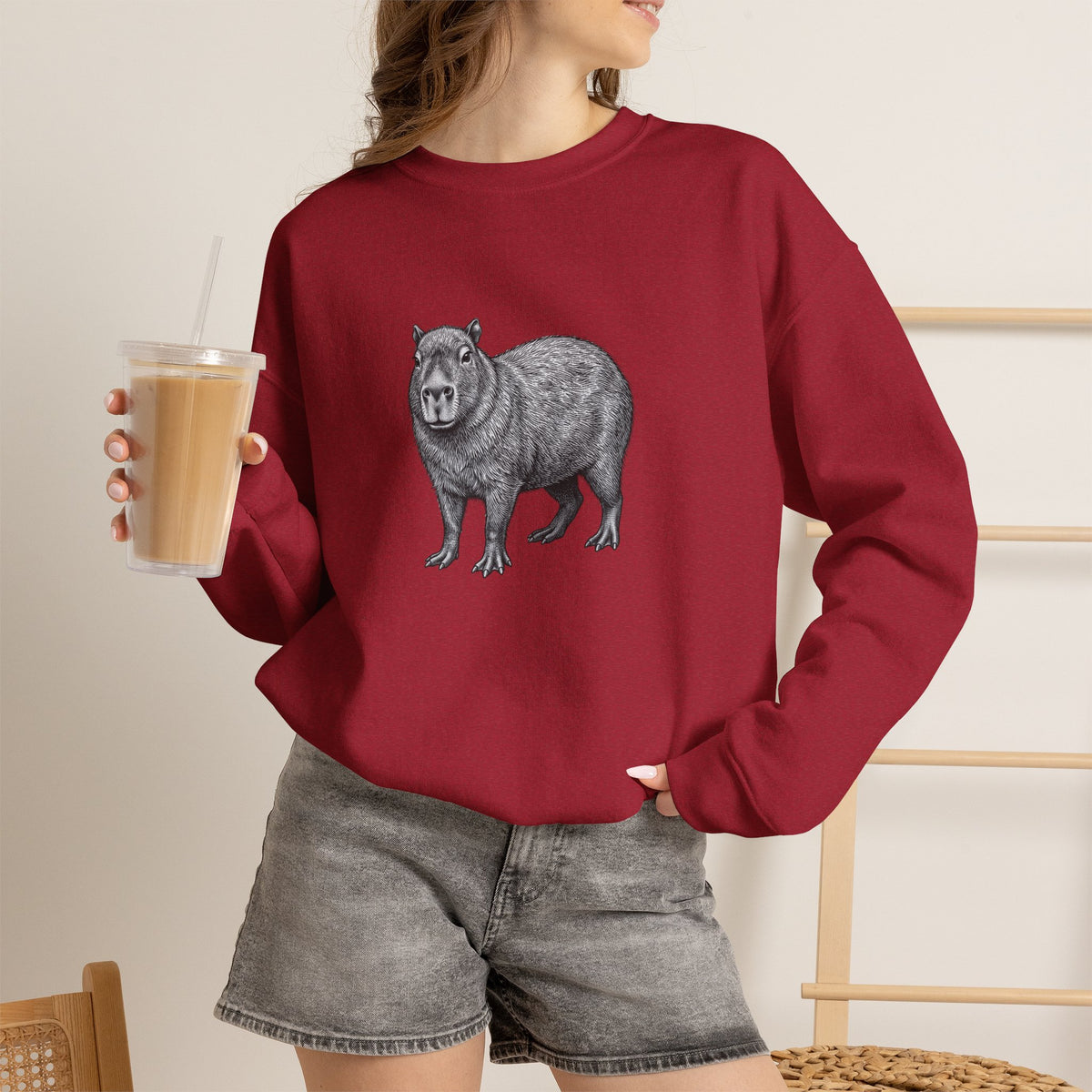 Capybara graphic sweatshirt from Wyldelife Collection by Printify featuring wildlife art with a cozy, casual style.