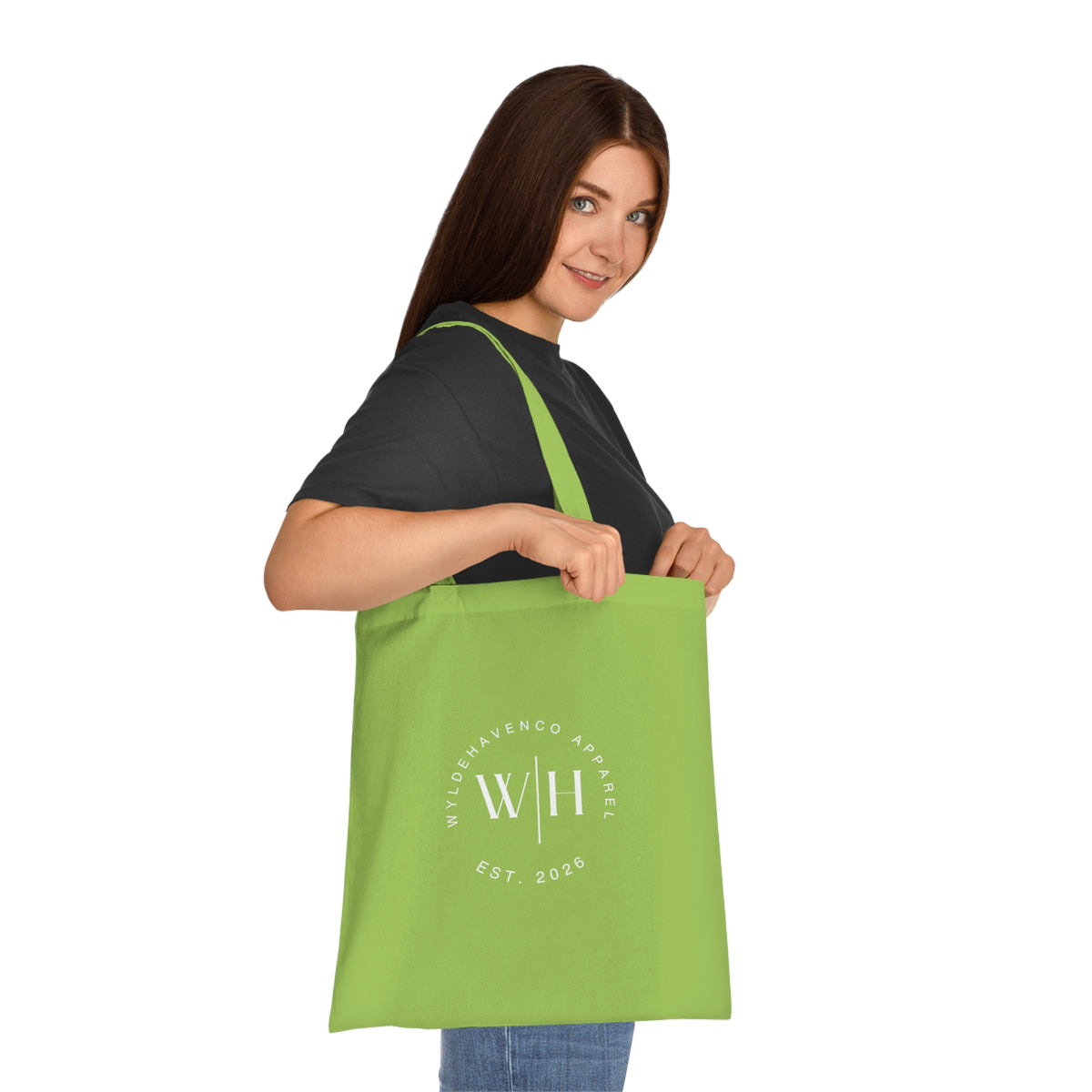 White cotton tote bag with black monogram circle and WH logo, featuring durable canvas material and sturdy handles.