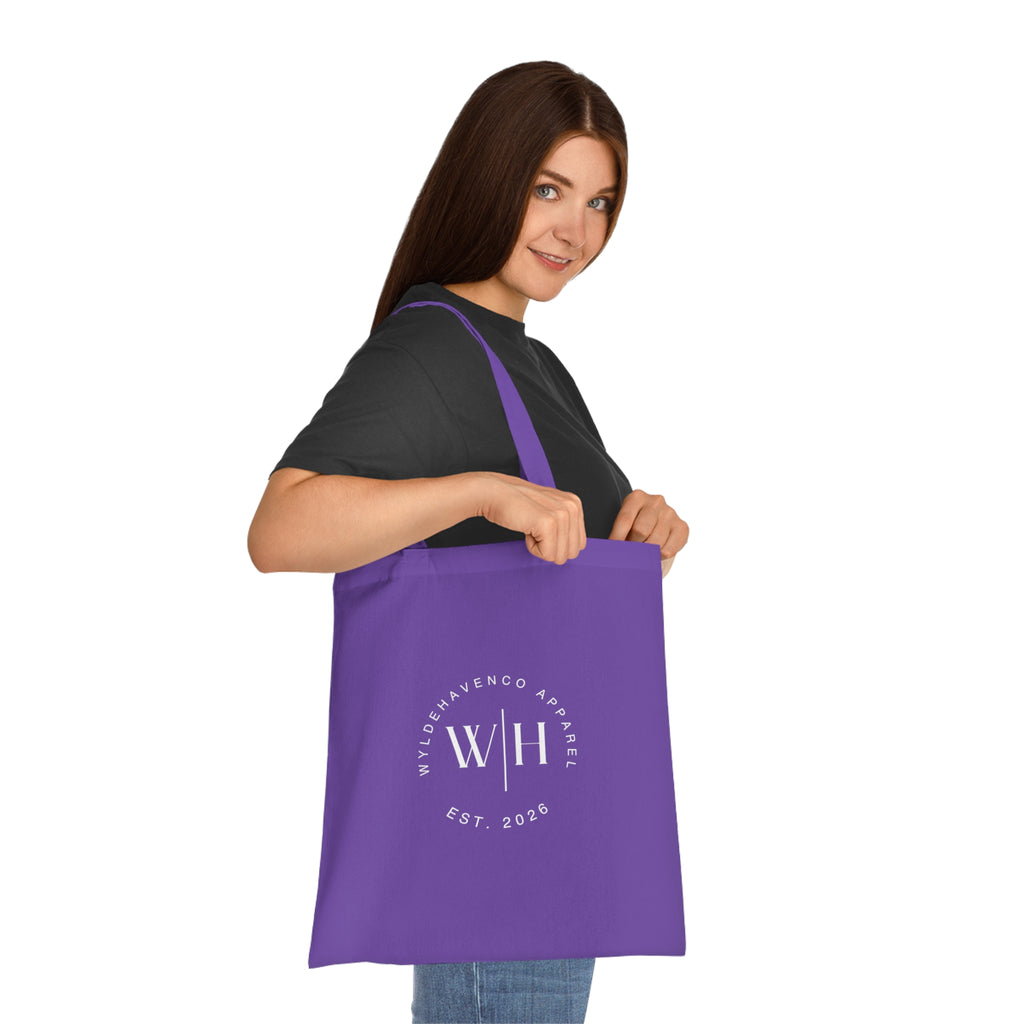 White canvas tote bag with monogram circle design and WH logo, made of cotton, by Printify.