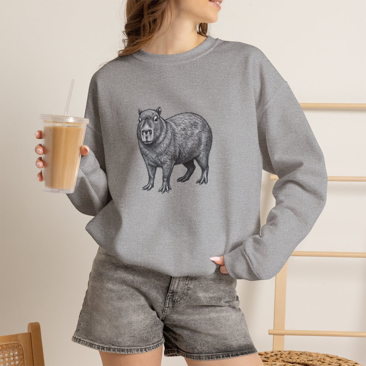 Printify Capybara graphic sweatshirt featuring wildlife art from the Wyldelife Collection, with detailed capybara illustration on soft fabric.