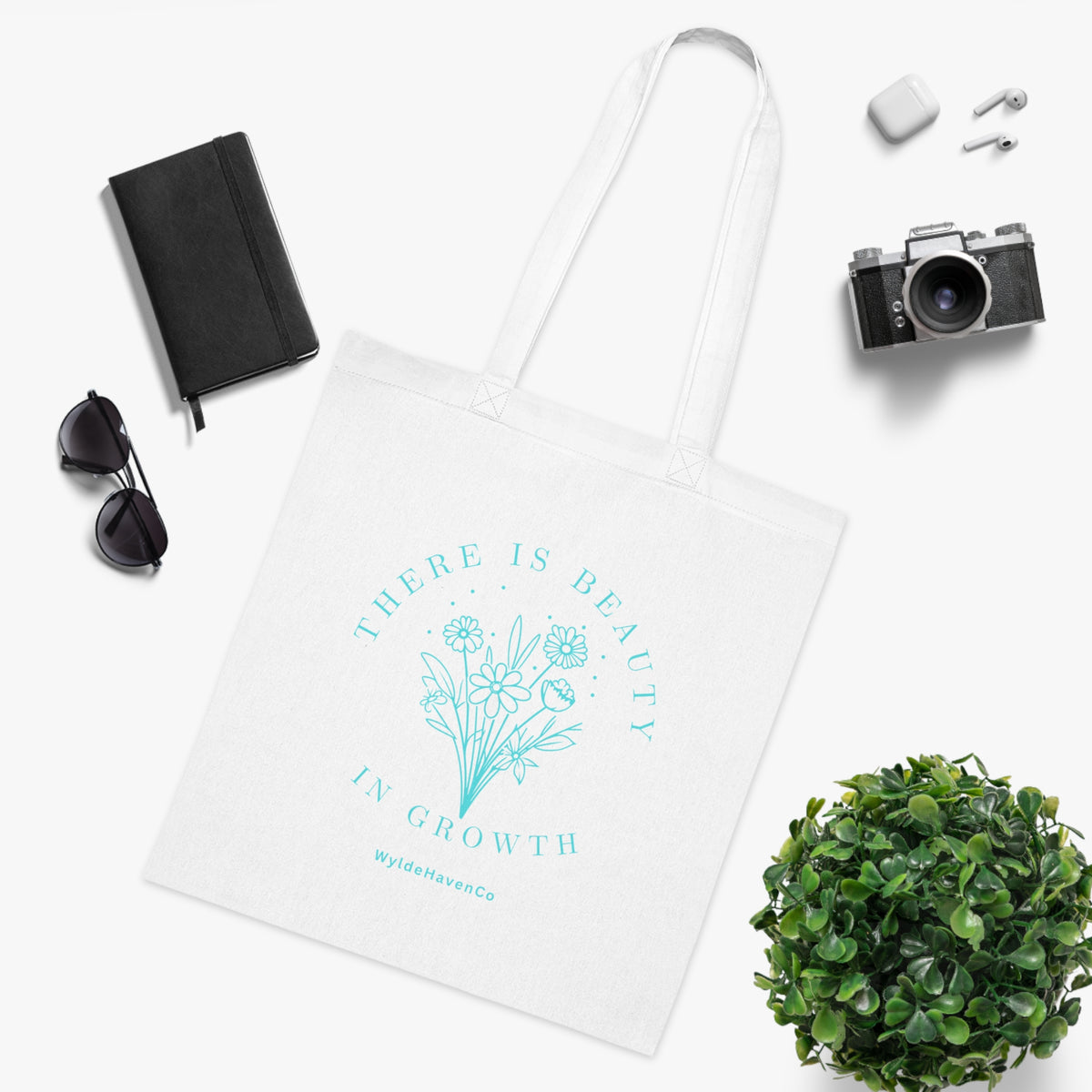 Floral cotton tote bag with inspirational "There Is Beauty In Growth" print, eco-friendly design by Printify.