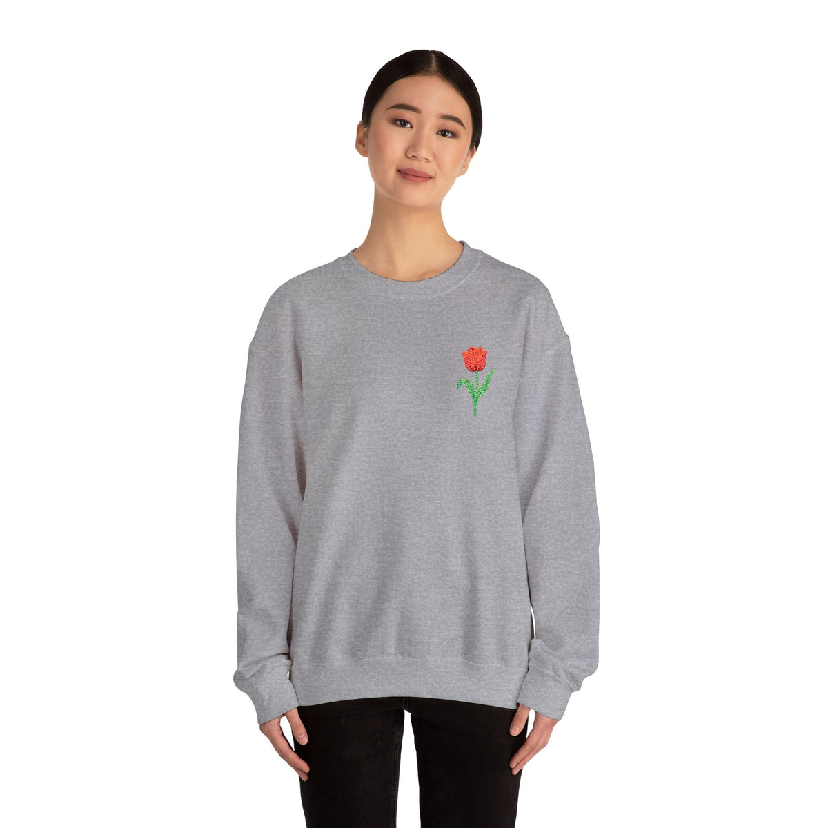 Unisex embroidered sweatshirt with floral tulip design on the left chest, featuring a comfortable fit and printed branding.