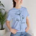 Still Growing floral print minimalist T-shirt by Printify featuring a simple, inspirational floral design on a casual tee.
