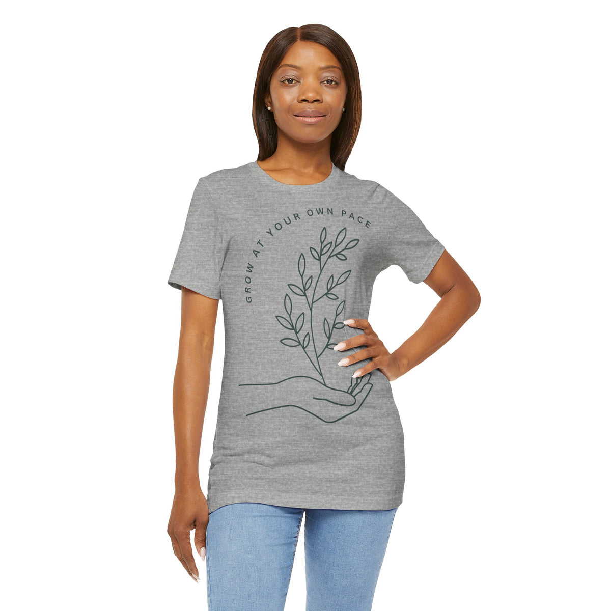 Minimal botanical T-shirt by Printify featuring "Grow At Your Own Pace" slogan on soft fabric.