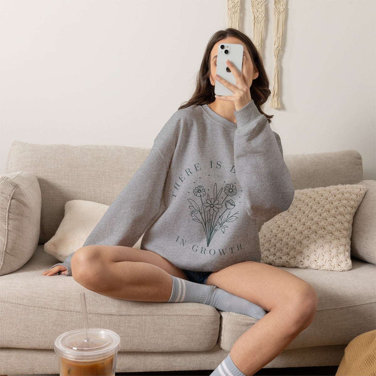 Printify crewneck sweatshirt with floral minimalist design and the phrase "There Is Beauty in Growth" printed on the front.