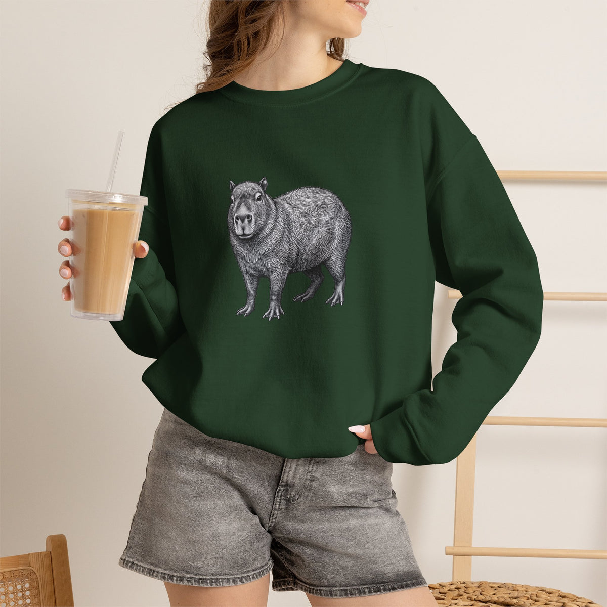 Capybara graphic sweatshirt from Wyldelife Collection featuring original wildlife art by Printify, showcasing a detailed capybara design.