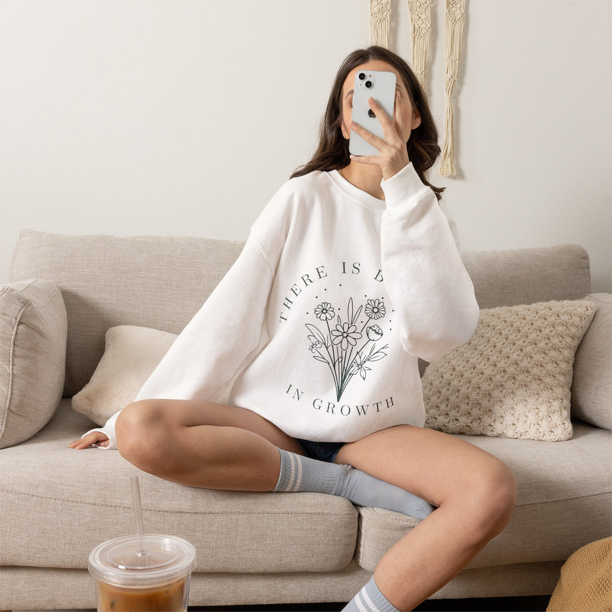 Printify crewneck sweatshirt with floral minimalist design and "There Is Beauty in Growth" quote on soft fabric.