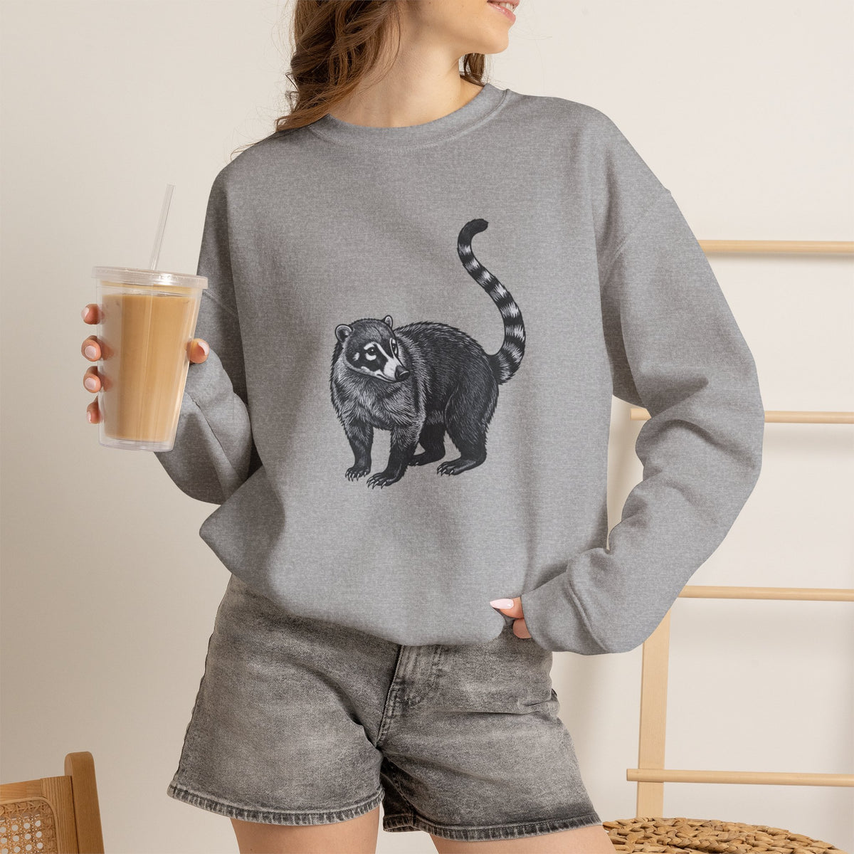 Coati graphic sweatshirt from Wyldelife Collection featuring original wildlife art, made by Printify, with detailed coati illustration on soft fabric.