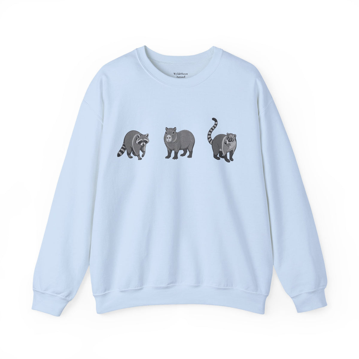 Wildlife Trio graphic sweatshirt featuring raccoon, capybara, and coati from Wyldelife Collection, with colorful animal illustrations.
