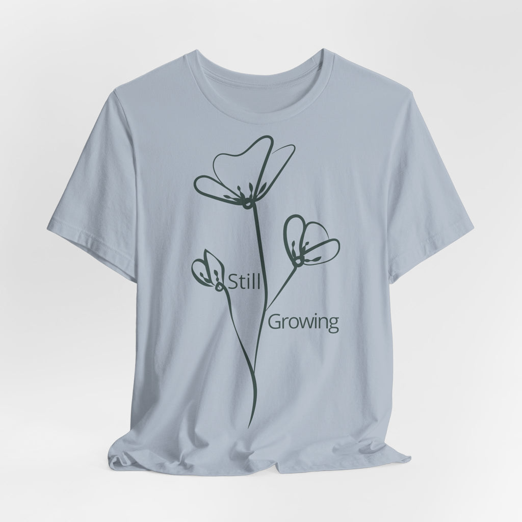 Still Growing Floral T-Shirt by Printify featuring a minimalist floral design on a casual T-shirt.