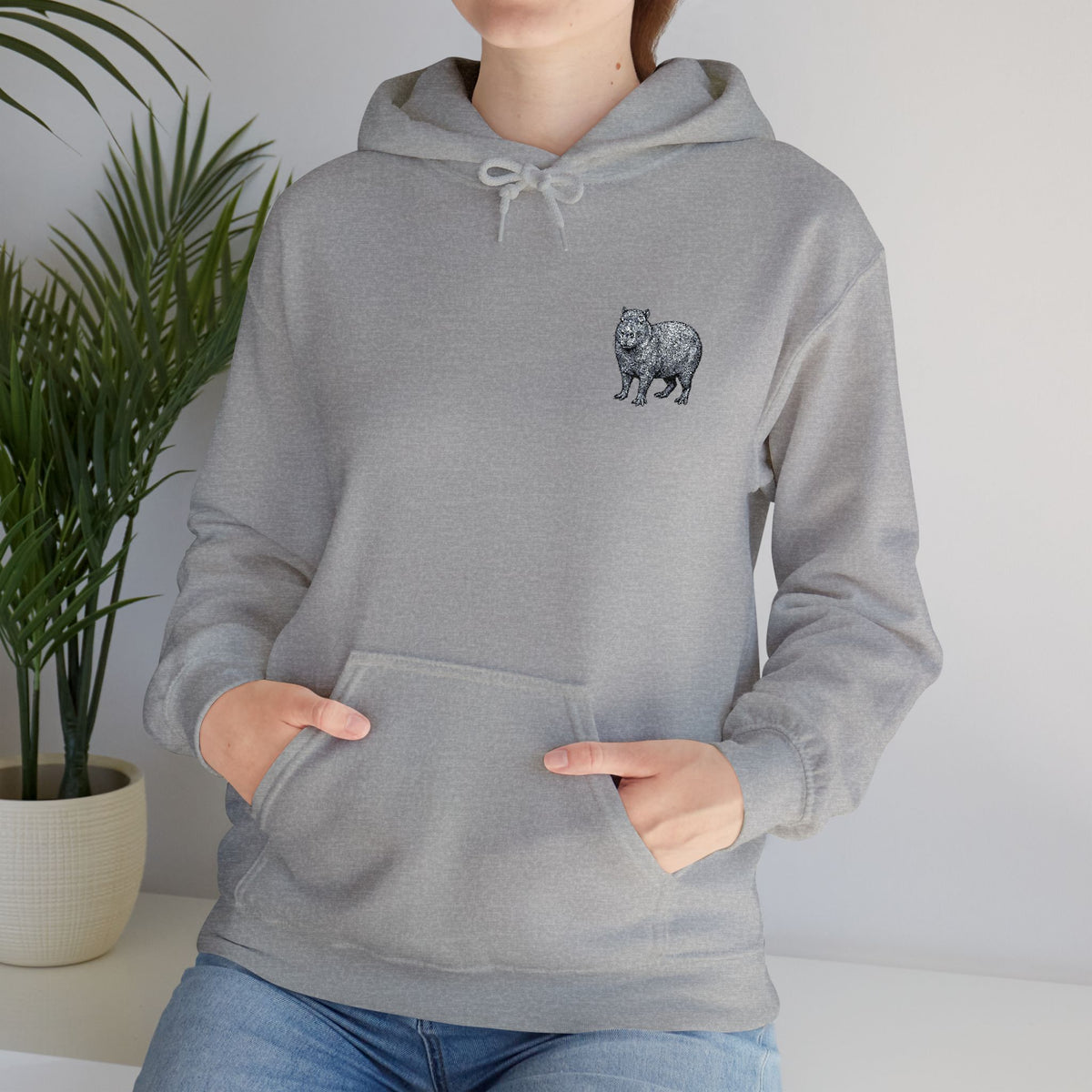 Printify Capybara embroidered hoodie from Wyldelife Collection featuring wildlife design, soft fabric, and detailed embroidered artwork.