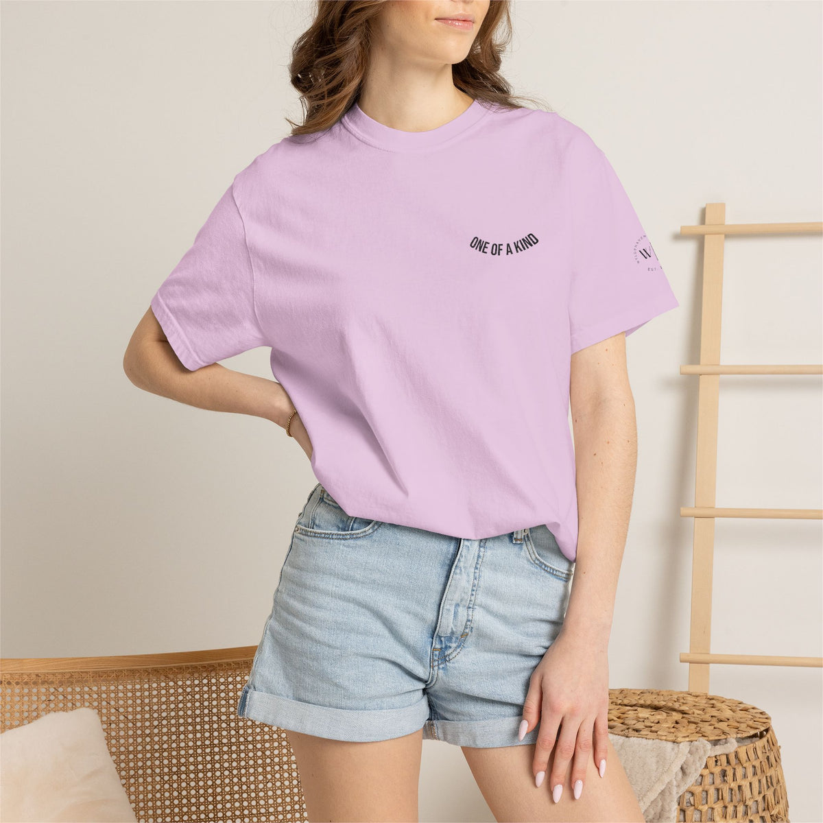 Black Printify "One of a Kind" Chest Logo T-shirt with a small logo on the front, casual fit, and short sleeves.