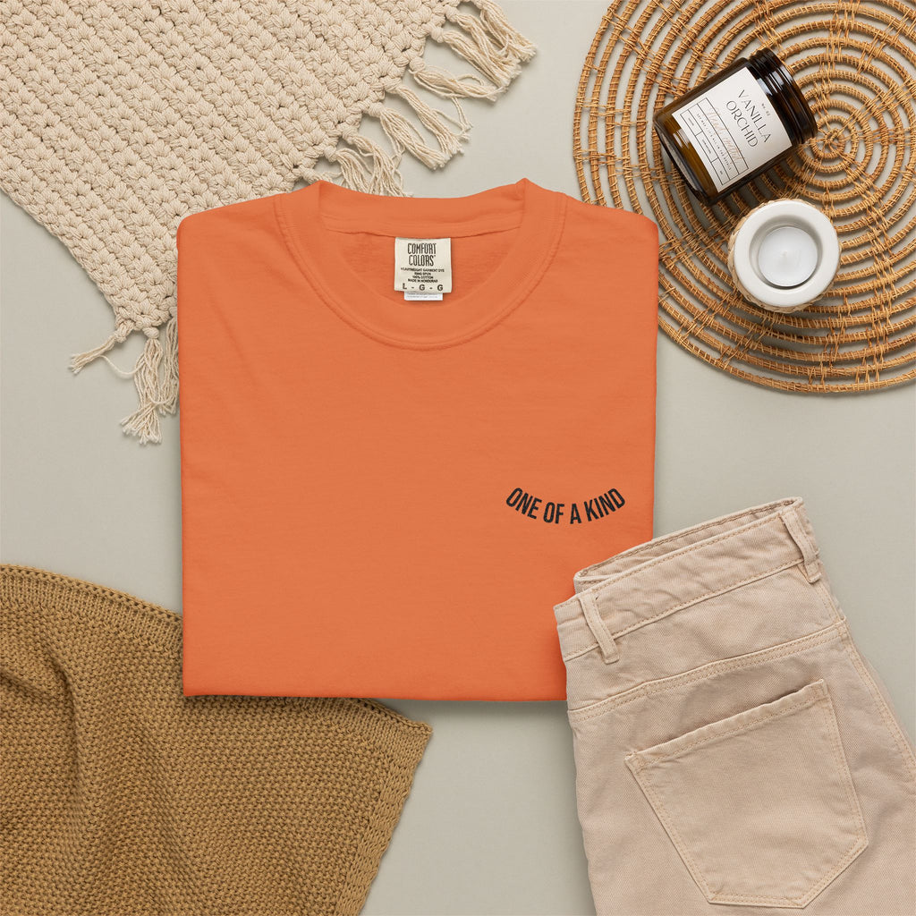 Printify "One of a Kind" chest logo T-shirt featuring a simple design on soft fabric, perfect for casual wear.