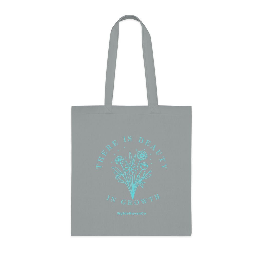 Floral cotton tote bag with "There Is Beauty In Growth" inspirational print, eco-friendly reusable bag by Printify.