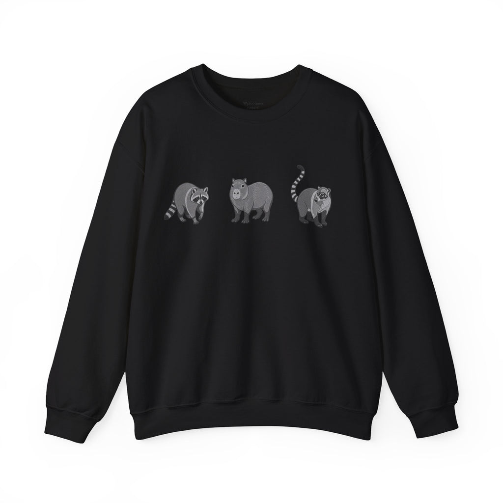 Wildlife Trio graphic sweatshirt by Printify featuring raccoon, capybara, and coati images from Wyldelife Collection.