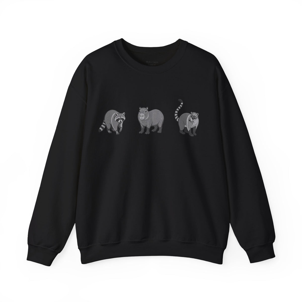 Wildlife Trio graphic sweatshirt by Printify featuring raccoon, capybara, and coati images from Wyldelife Collection.
