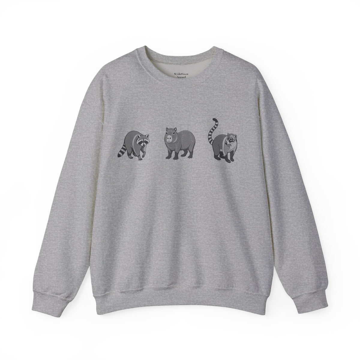 Wildlife Trio sweatshirt featuring raccoon, capybara, and coati animal illustrations from Wyldelife Collection by Printify