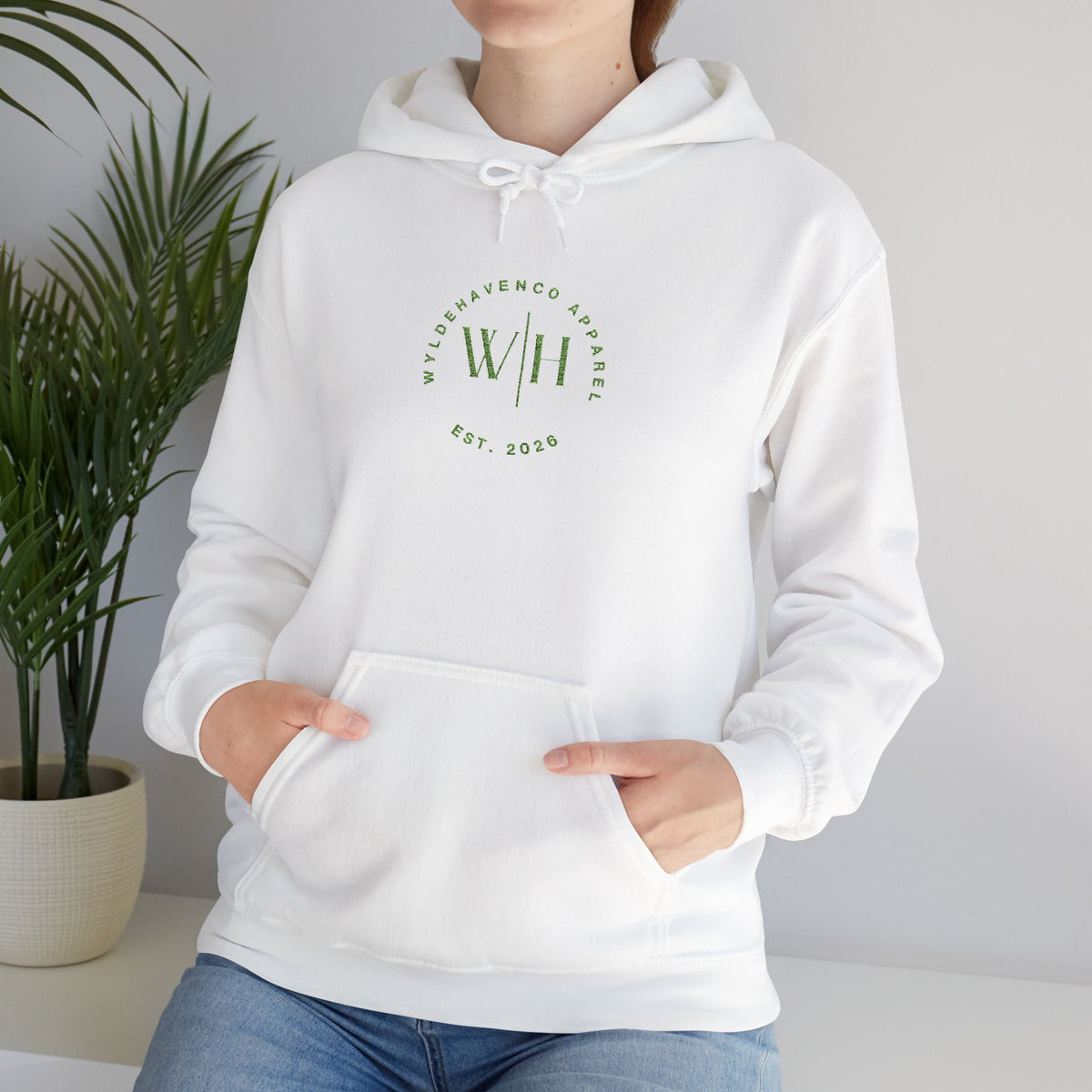 Green WyldeHaven logo embroidered hoodie by Printify, showcasing a cozy hoodie with detailed logo embroidery on the front.
