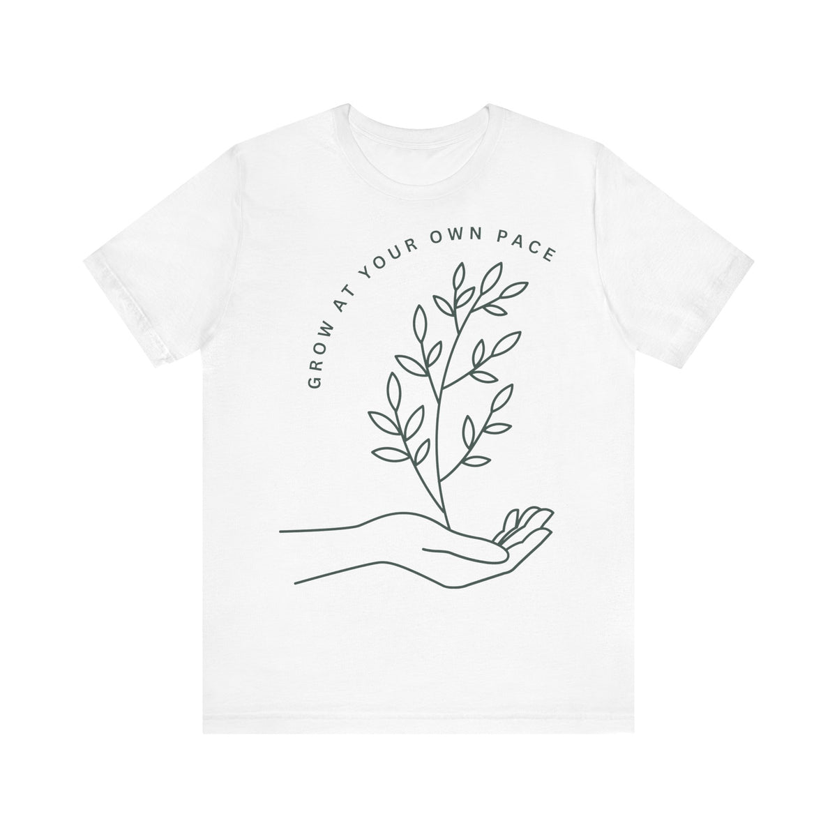 Minimal botanical T-shirt by Printify featuring "Grow At Your Own Pace" slogan on soft fabric with plant-inspired design.