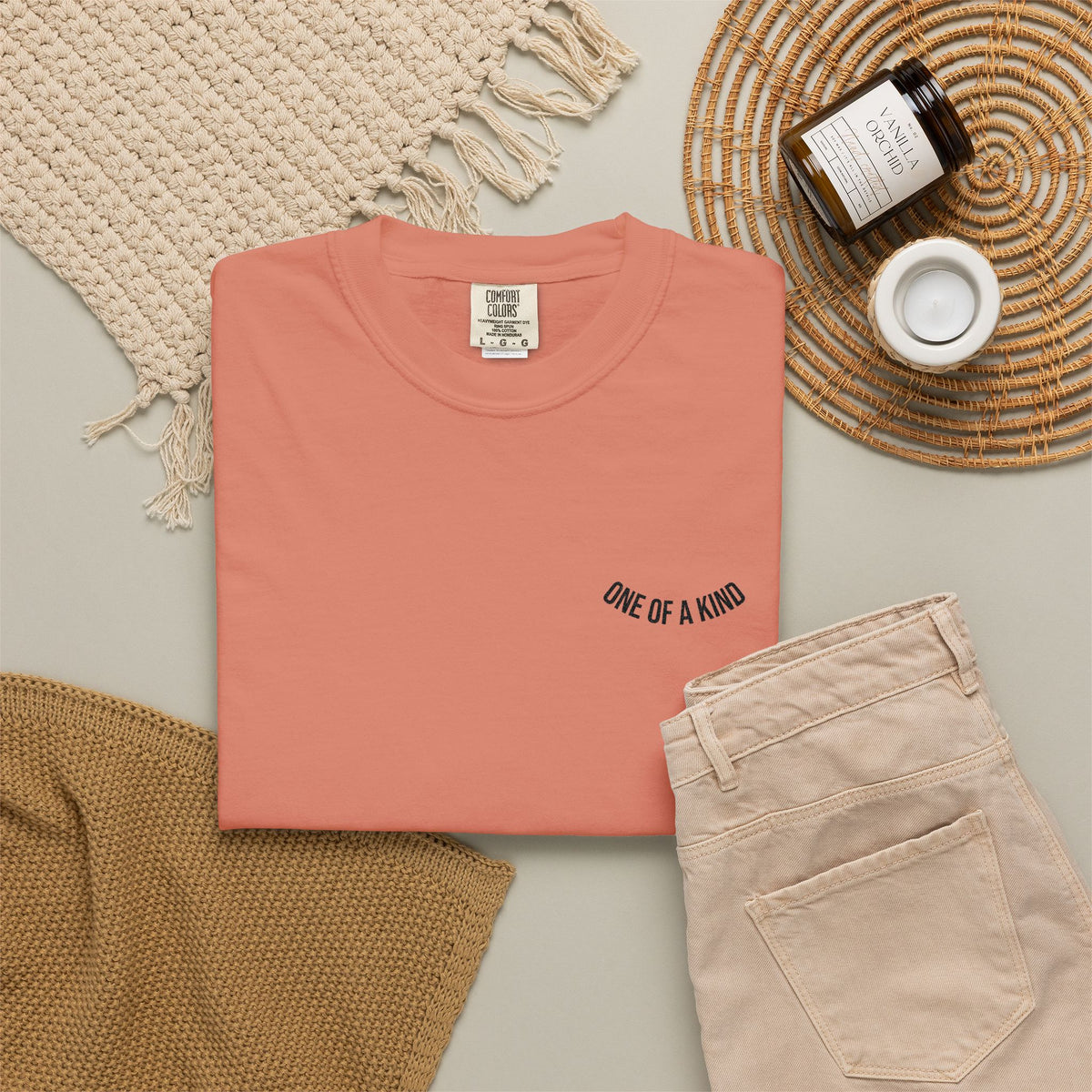 White "One of a Kind" Chest Logo T-Shirt by Printify, featuring a minimalistic chest logo design on soft cotton fabric.