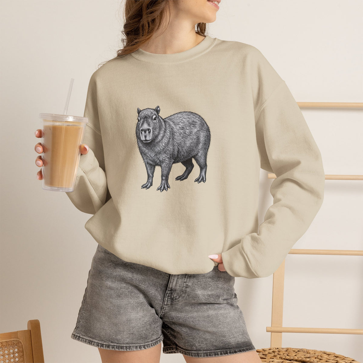 Capybara graphic sweatshirt from Wyldelife Collection featuring original wildlife art, displayed on a comfortable casual sweatshirt.