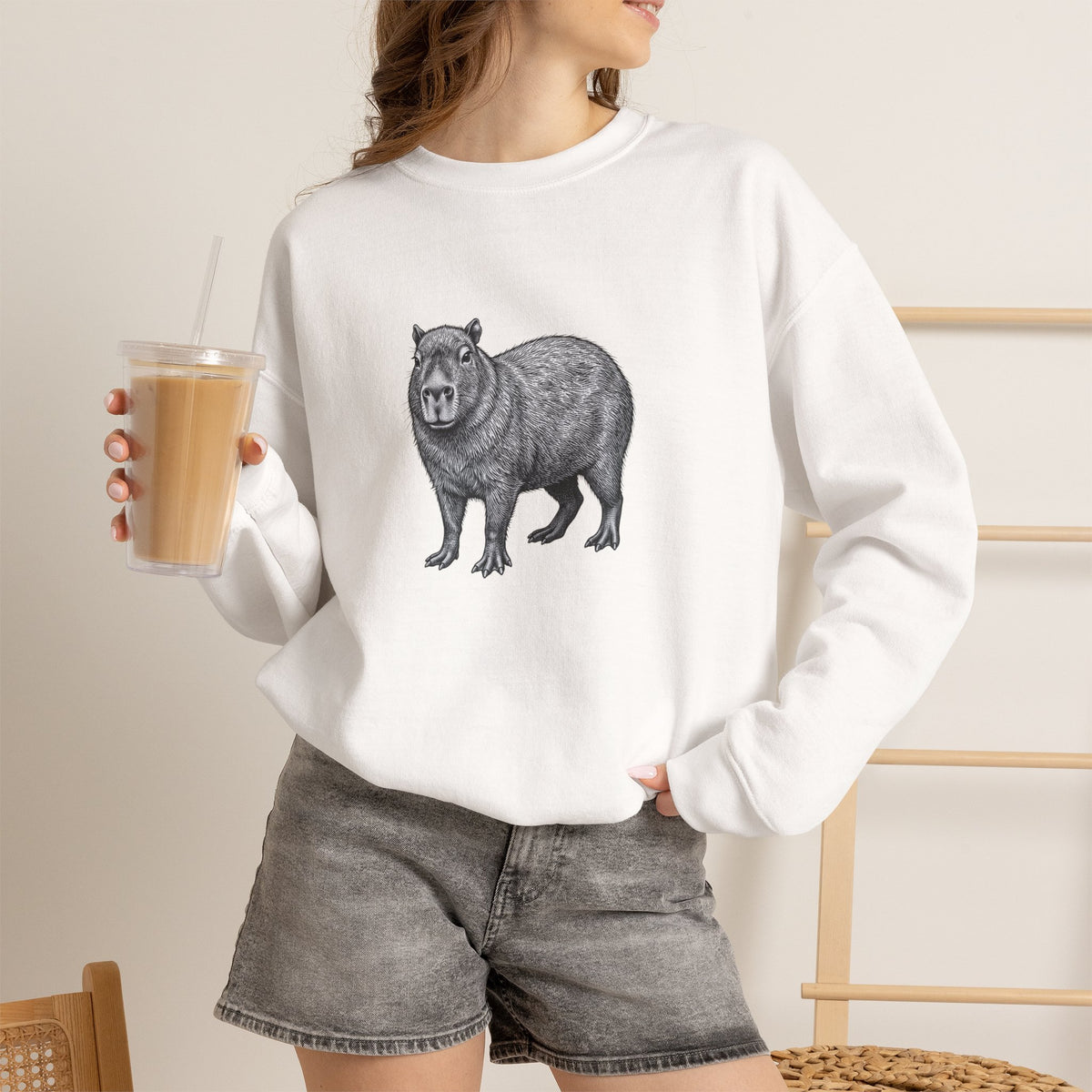 Printify Capybara graphic sweatshirt featuring wildlife art from the Wyldelife Collection with detailed capybara illustration.