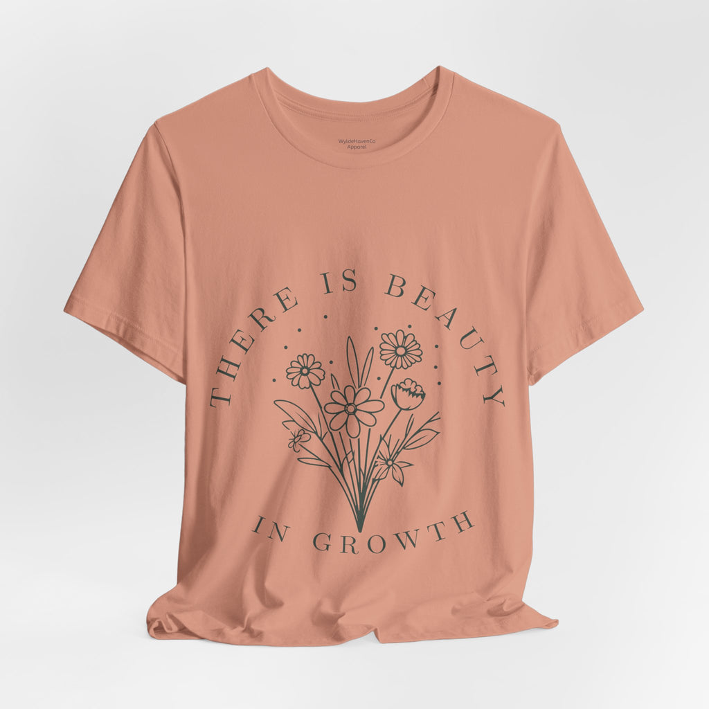 Printify floral T-shirt with "There Is Beauty In Growth" graphic, featuring vibrant flower designs on a casual cotton tee.