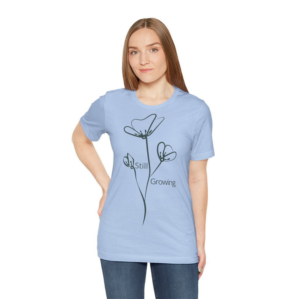 Still Growing Floral T-Shirt by Printify featuring a minimalist floral design on a casual, inspirational cotton tee.