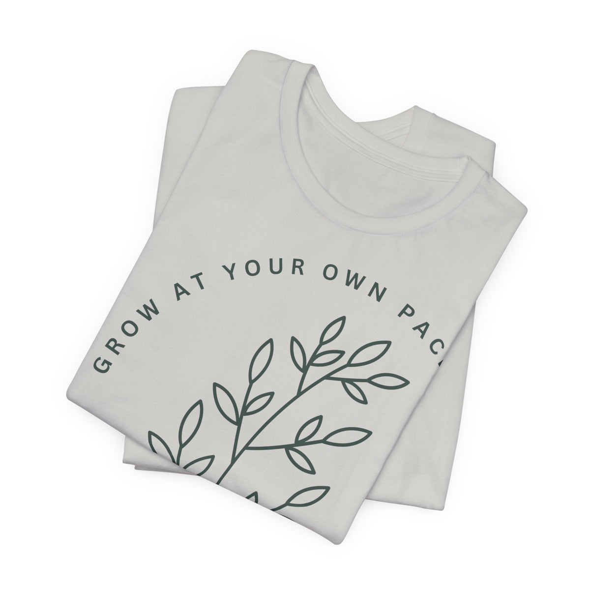 Minimal botanical print t-shirt with "Grow At Your Own Pace" slogan by Printify, featuring a soft fabric and casual fit.